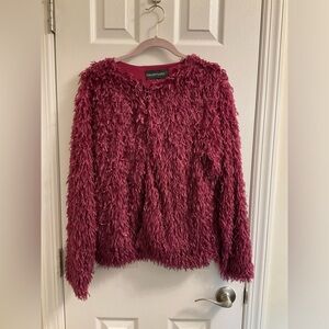 Woman’s burgundy cardigan, lined with hook closure